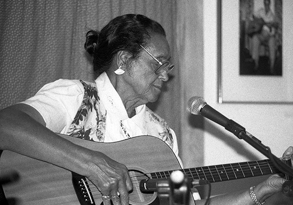 woman playing guitar