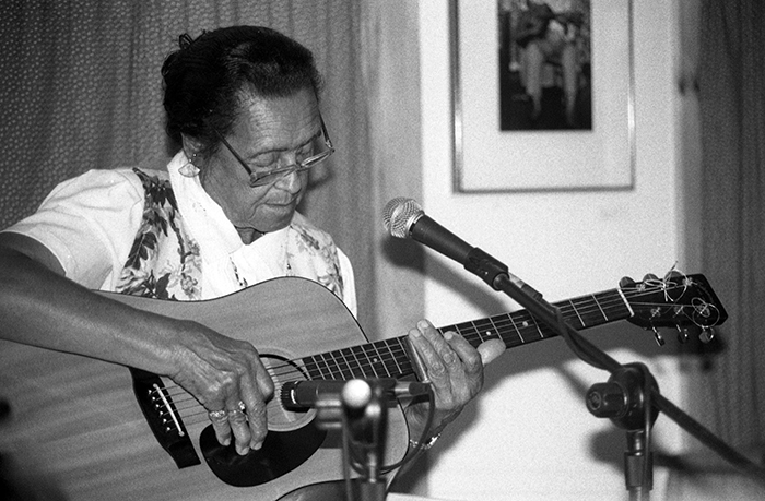 woman playing guitar