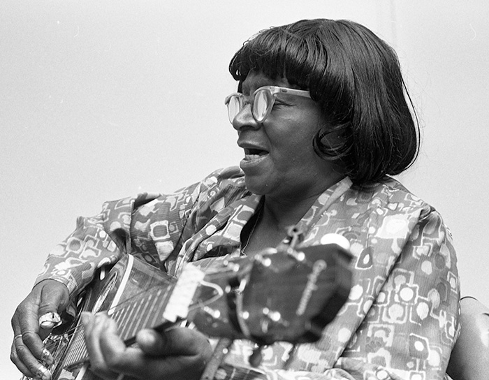 woman playing guitar