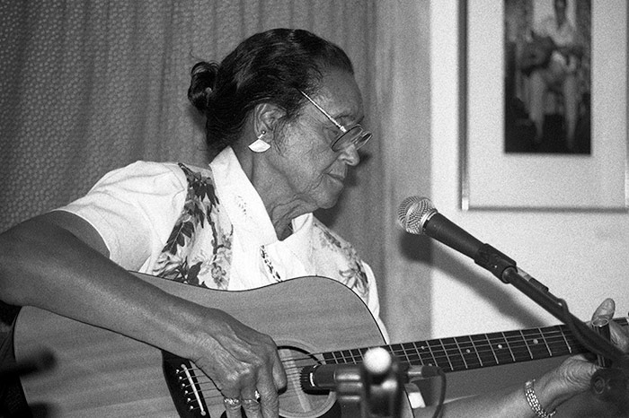 woman playing guitar