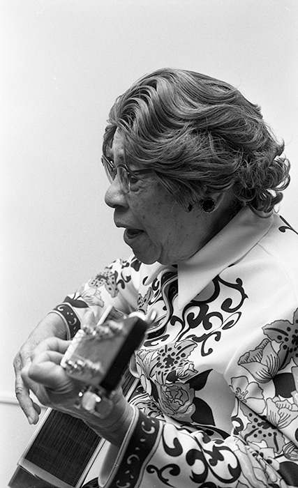 woman playing guitar