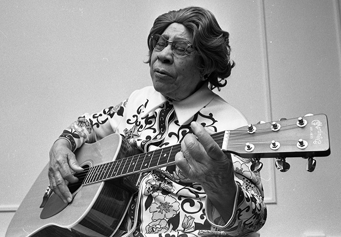 woman playing guitar