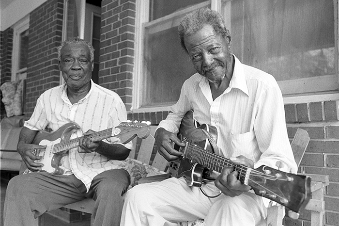 men playing guitars