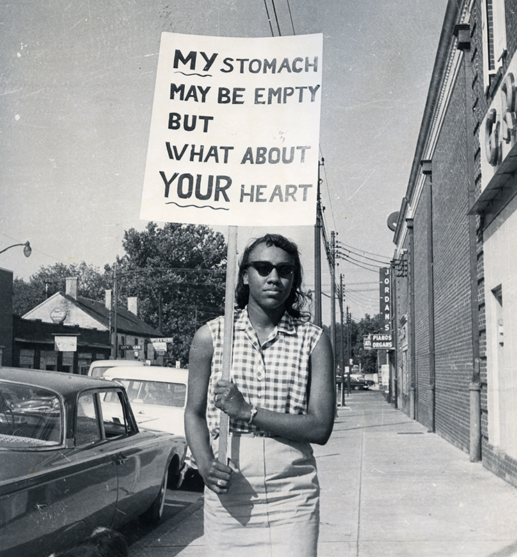 woman holding sign