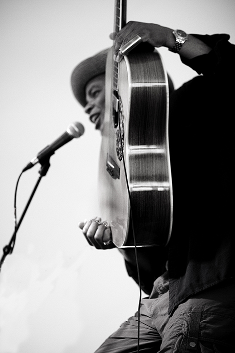 man singing and playing guitar
