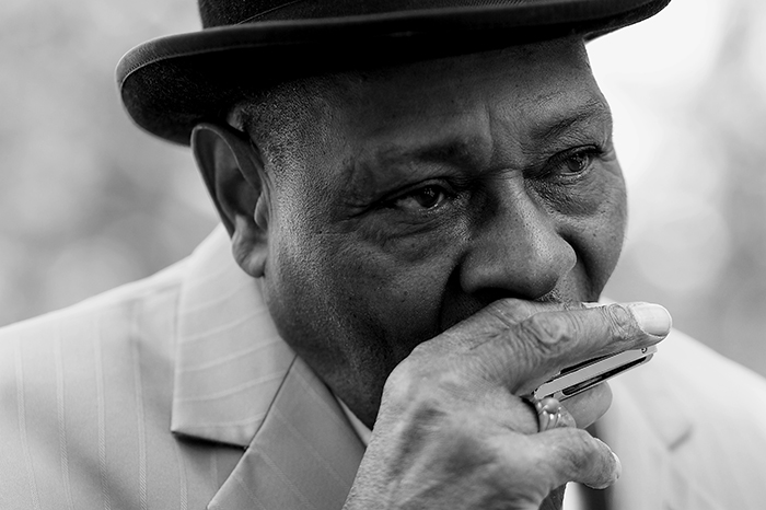 man playing harmonica