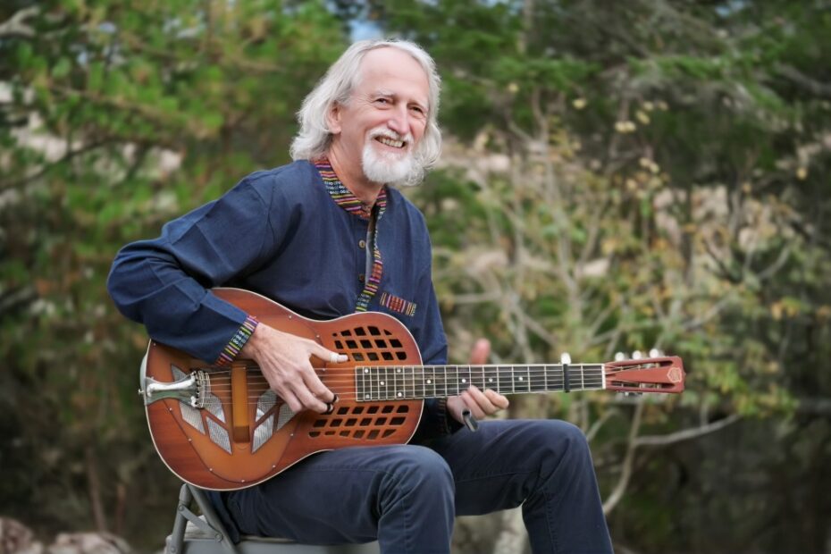 John “Greyhound” Maxwell playing guitar