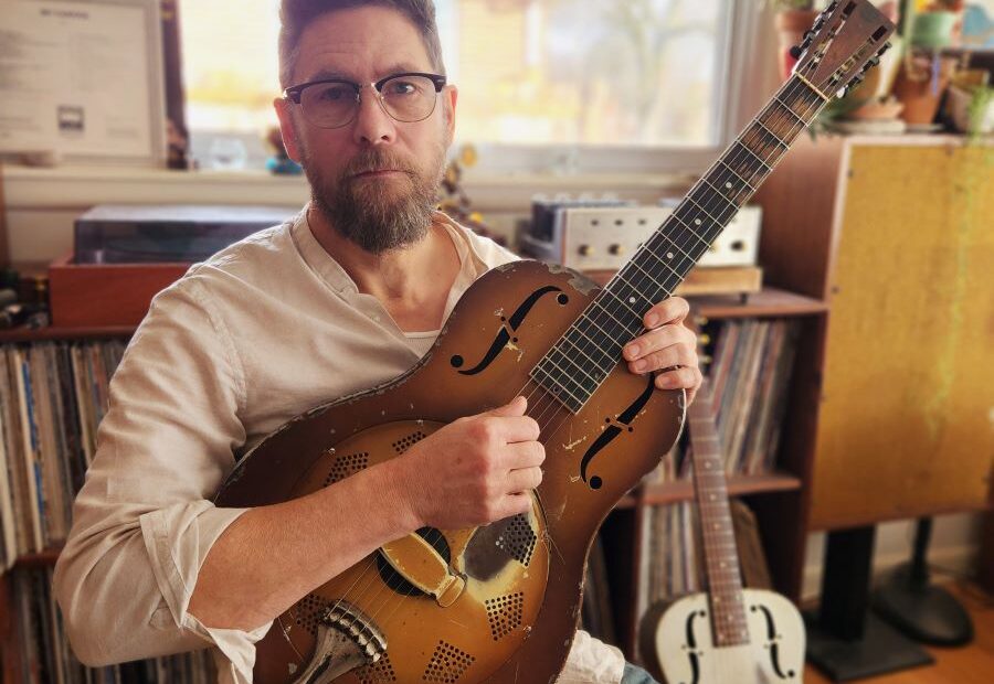 Rollie Tussing with guitar