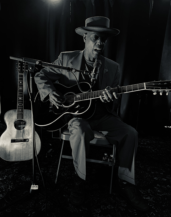Eric Bibb playing guitar