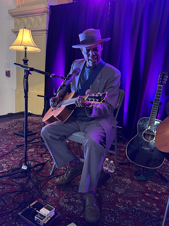 Eric Bibb playing guitar