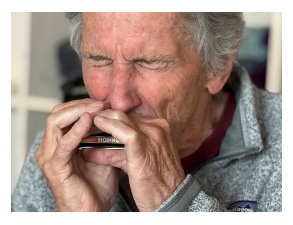 Walter Liniger playing harmonica