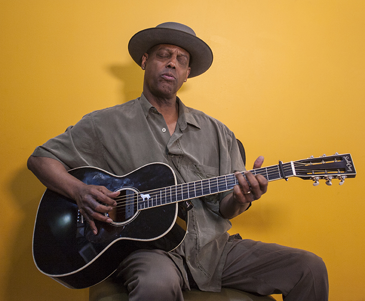 Eric Bibb playing guitar
