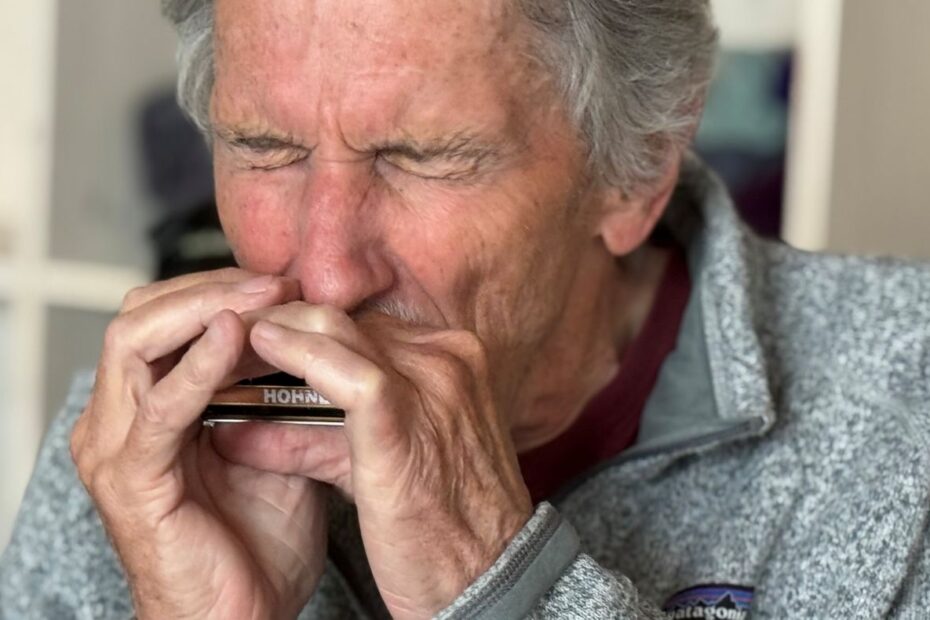 Walter Liniger playing harmonica