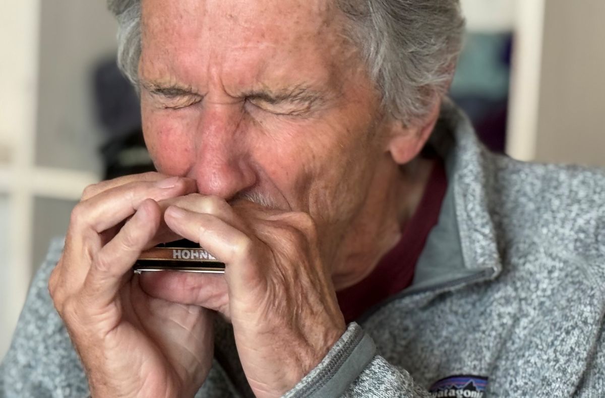 Walter Liniger playing harmonica
